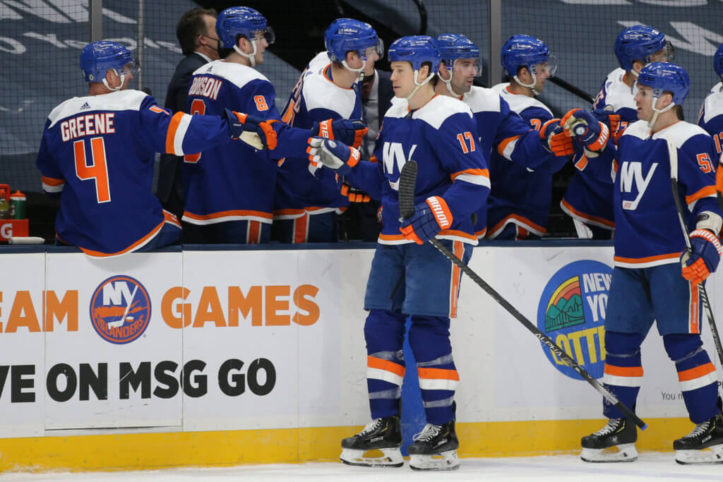 A group of men in blue and white hockey uniforms.