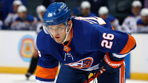 A hockey player in blue and white uniform.