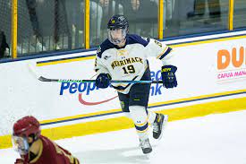 A hockey player is running on the ice.